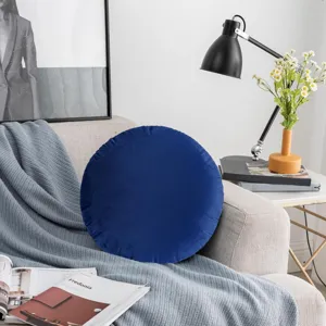 Round dark blue velvet decorative throw pillow detail shot for cozy modern living room decor