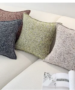 Getextureerde chenille kussenhoes detail, elegant zacht kussen voor bank en woonkamer.