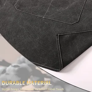 Thickened canvas work apron detail showcasing durable fabric texture and fine stitching.