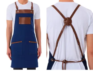 Canvas and leather splicing apron details showing adjustable cross back straps and front tool pockets.