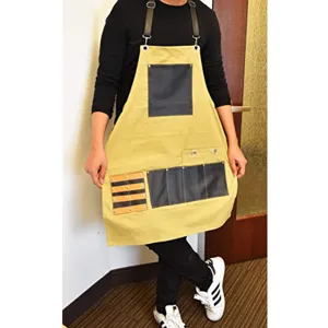 Detailed shot of multi-pocket canvas work apron with leather straps for carpentry and cooking.