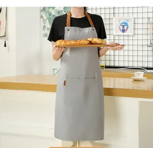 Nordic grey canvas apron with brown straps, stylish kitchen work apron for cooking and baking.