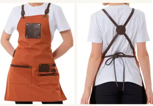 Close-up view of durable canvas and leather work apron featuring functional pockets and hardware.