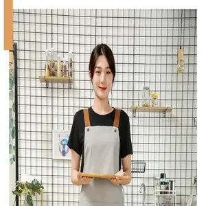 Nordic minimalist canvas kitchen apron with adjustable straps for women restaurant work wear.