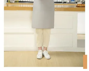 Grey canvas half apron detail, minimalist kitchen cooking workwear with front pocket