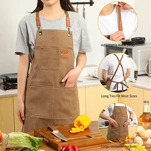 Detailed view of heavy duty canvas apron with adjustable neck strap and large utility pockets.