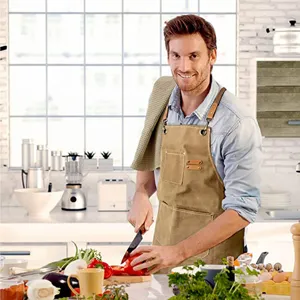 Thickened canvas work apron with leather straps and deep pockets for kitchen and gardening use.
