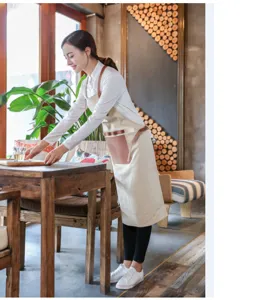 Tablier en toile de style coréen avec lanières en cuir pour les cafés et la restauration.