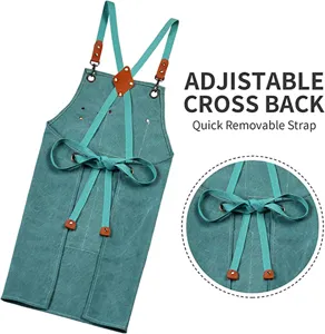 Adjustable cross back canvas apron with quick removable strap for kitchen and gardening work.
