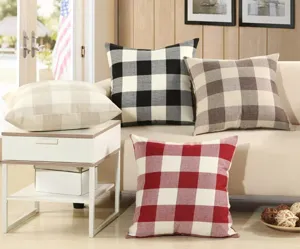 Detailed view of classic buffalo plaid cushion covers, soft cotton linen texture for home decor.
