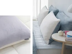 Detailed view of soft flannel color-block pillowcase, comfortable double-sided textile texture.