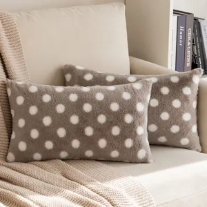 Fluffy faux rabbit fur polka dot pillow detail shot showing soft texture and cozy home style.