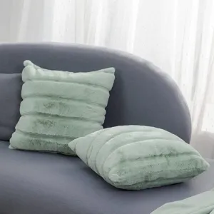 Cozy mint green faux fur pillow detail, soft plush texture for modern living room sofa decor.