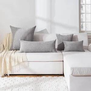 Grey corduroy body pillow and throw pillow set, modern striped design for living room sofa.