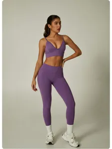 Seamless purple sports bra and high waist yoga leggings set for fitness gym running workout.