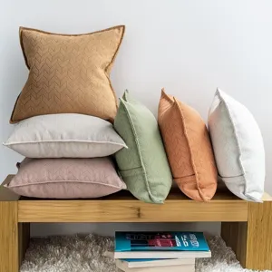 Textured chenille throw pillow detail, cozy herringbone cushion for sofa and bed decor.