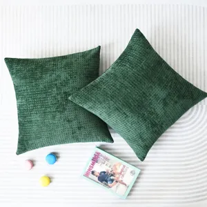 Dark green corduroy chenille throw pillow cover detail scene with elegant texture.