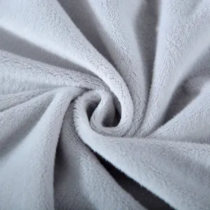 Soft grey plush fabric close-up, showing delicate texture and smooth cozy tactile detail.