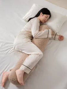 Sherpa bolster pillow detail showing soft fleece texture and cozy bedroom setup nicely.