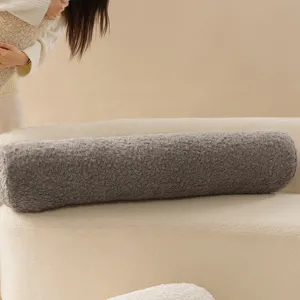 Cozy grey sherpa bolster pillow for sofa, soft cylindrical long cushion for living room decor.