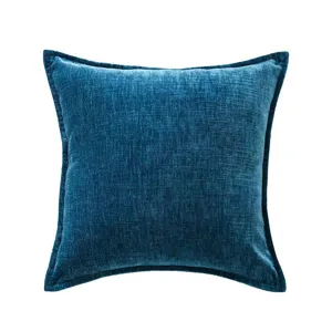 Blue chenille cushion detail, soft textured pillow fabric closeup, home decor texture view.