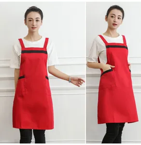 Red cotton work apron with black trim and pockets for kitchen, restaurant and daily use.