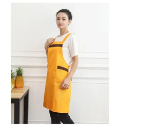 Yellow work apron with brown stripes and pockets, ideal for restaurant, kitchen, or daily use.