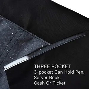 Black polyester server apron detail view with starry pocket design for restaurant staff.