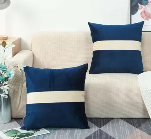 Modern dark blue and beige color-block velvet throw pillow detail view for cozy sofa decor.