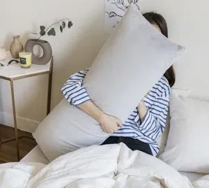 Cozy plush body pillow cover in light grey, soft velvet long cushion for bedroom comfort.
