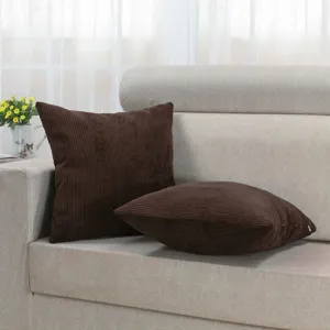 Brown corduroy throw pillow close-up, soft textured cushion fabric detail for modern sofa decor.