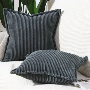 Close-up detail of dark grey corduroy striped cushion cover, showing soft ribbed texture.