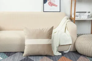 Detailed view of modern thickened velvet cushion pillow with spliced design in cozy living setup.