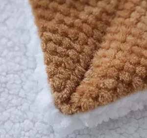 Close up of double-sided flannel and sherpa blanket texture detail, cozy and warm material.