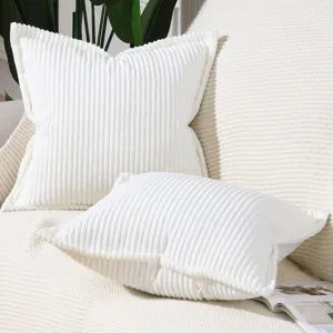 Close-up detailed shot of soft white corduroy striped pillow cover for modern sofa decor.