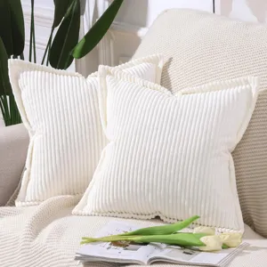 Detailed shot of white corduroy striped pillowcases showcasing soft texture and cozy home decor style.