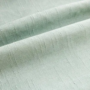 Dettaglio in primo piano del tessuto morbido verde chiaro della fodera in ciniglia.