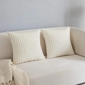 Corduroy throw pillow detail shot showcasing soft textured fabric on a cozy living room sofa.