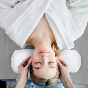 Cylindrical beauty pillow and neck support bolster for spa massage and relaxing comfort use.