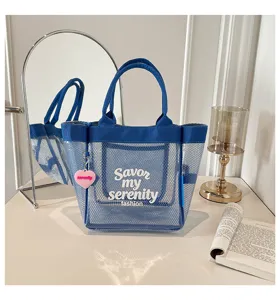 Blue transparent mesh tote bag, stylish large capacity waterproof shoulder bag with heart pendant.