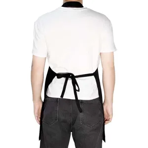 Vista posterior detallada del delantal de trabajo negro ajustable con correas para la cocina.