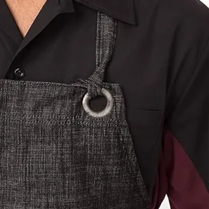 Cotton linen work apron detail, dark grey texture fabric with metal ring strap design.