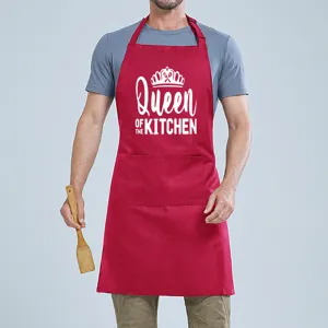 Detail view of a red cooking apron featuring a front pocket and white novelty print graphic.