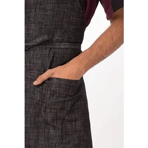 Men cotton linen apron detail showcasing fabric texture, front pocket, and adjustable waist ties.