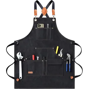 Heavy duty canvas work apron with tool pockets and cross back straps for woodworking BBQ.