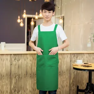 Green work apron with front pockets, durable fabric kitchen apron for restaurant chefs and servers.
