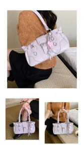 Stylish vintage PU leather shoulder bag for women with chic metal buckles and cute heart charm.