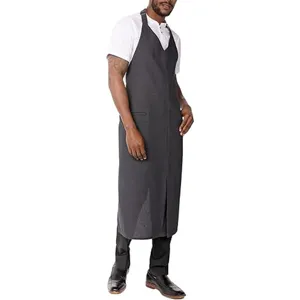 Detail view of dark gray long bib apron showing fabric texture, neck strap, and full coverage design.