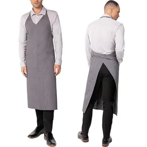 Grey cross-back work apron for kitchen restaurant cafe staff adjustable durable uniform.