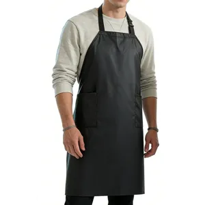 Detailed view of waterproof black kitchen apron featuring convenient front storage pockets.